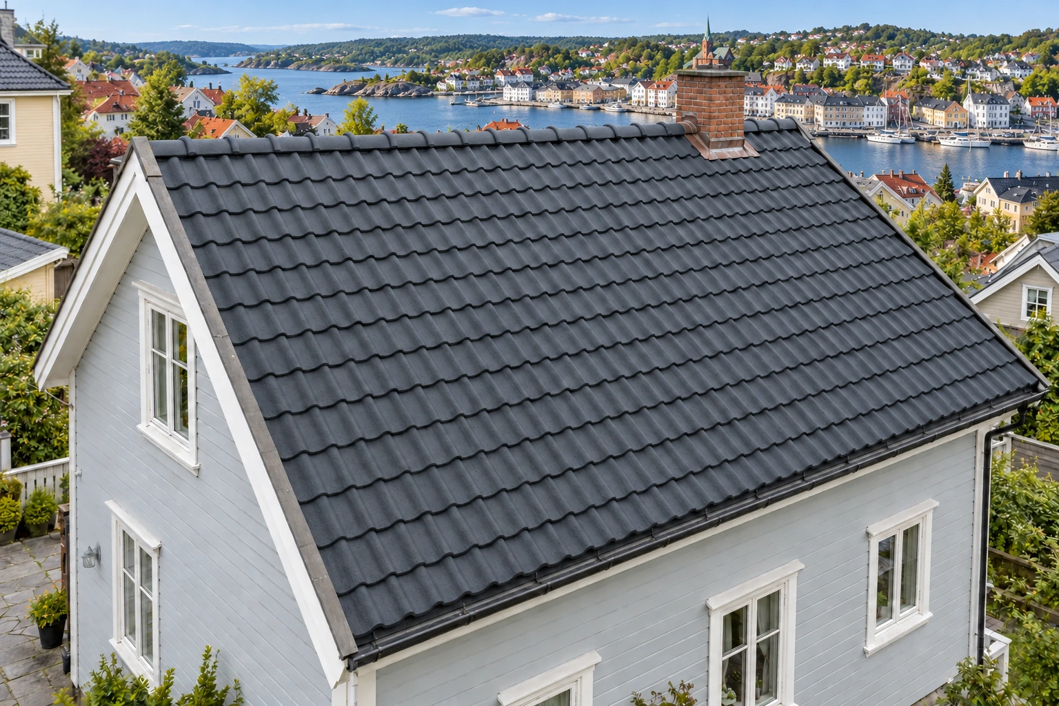 Eksisterende betongstein med en ny mørk overflatebehandling.